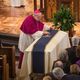 Bishop Daniel Jenky, C.S.C., Bishop of Peoria, IL, places a crucifix on the casket of Notre Dame President Emeritus Rev. Theodore M. Hesburgh, C.S.C.